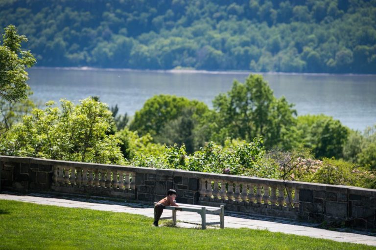 Boy leaning on bench